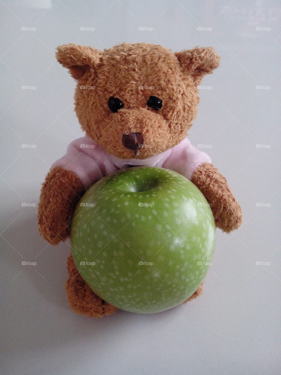 teddy bear with green apple