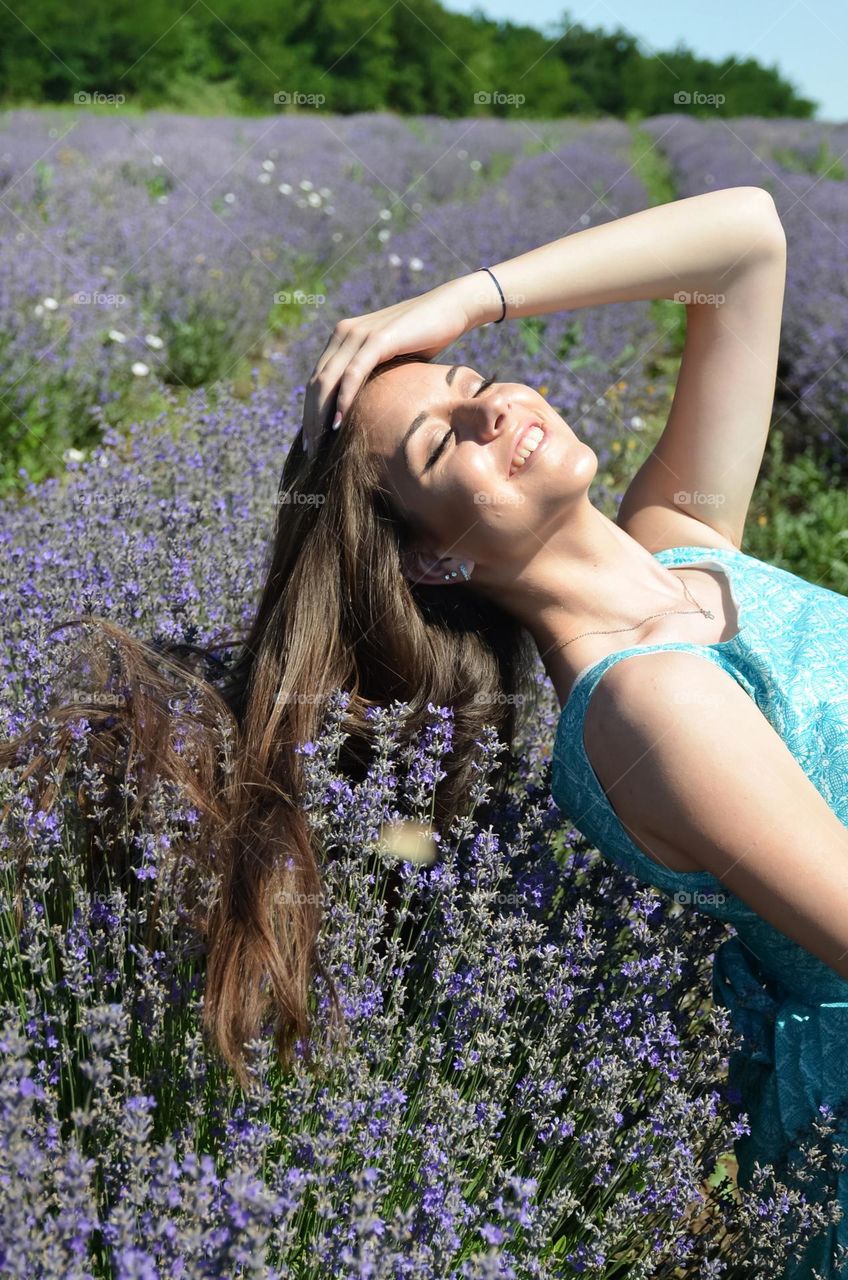 Woman with beautiful natural hair on lavender fields