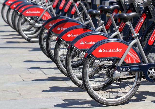 A row of Santander sponsored bikes from London's popular bicycle hire scheme. The bikes are also known as Boris bikes after the Mayor Of London, Boris Johnson.
