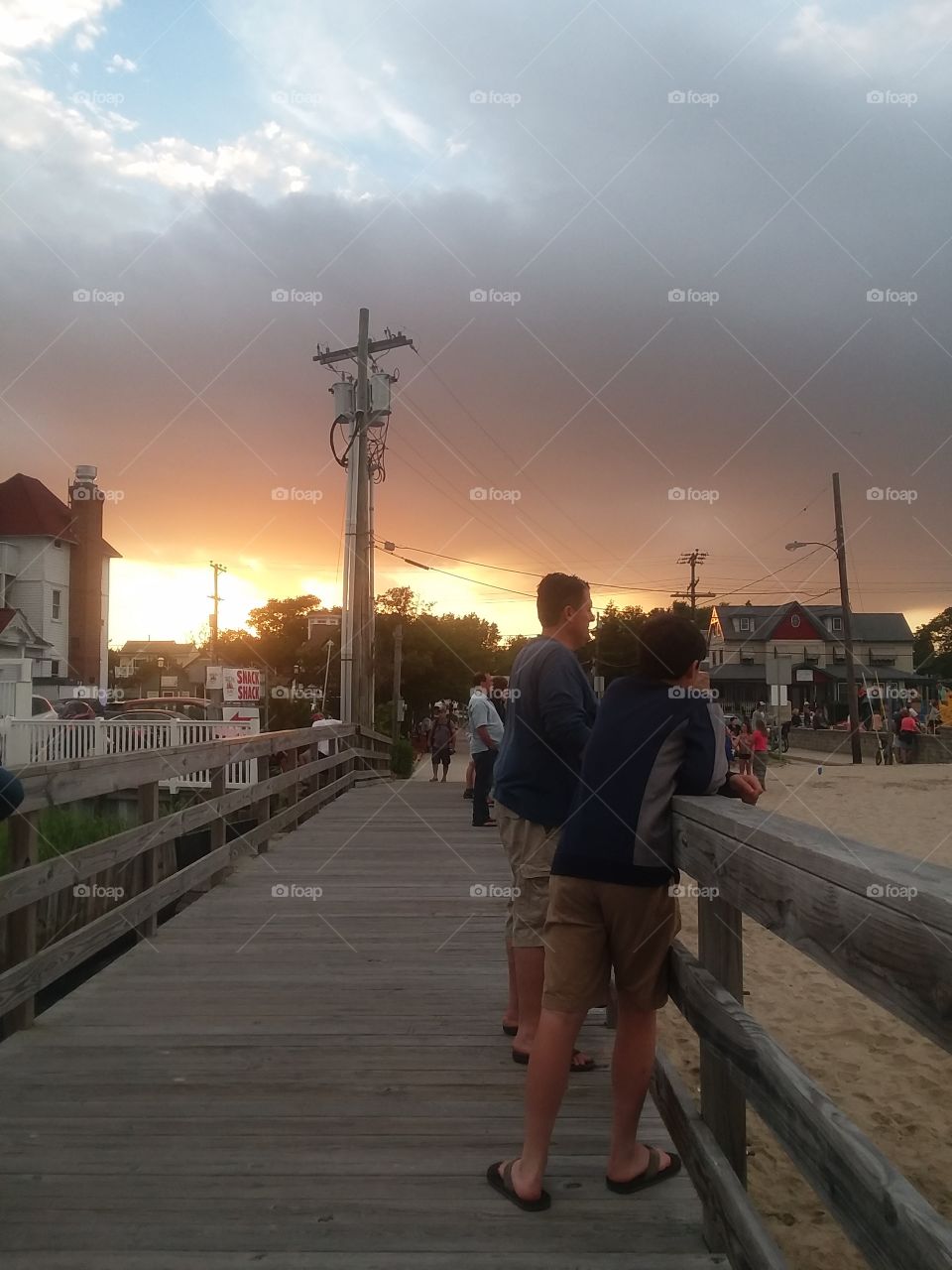 Stormy skies and sunset at beach concert in N.J.
