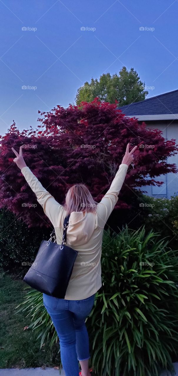 Happy about her maple tree