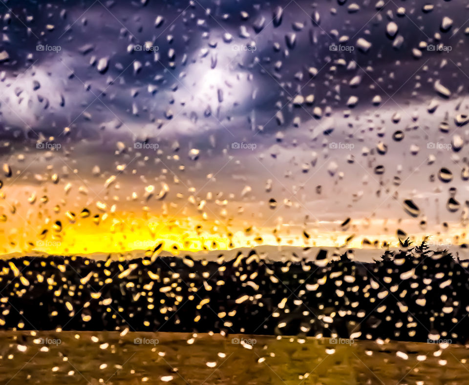 Beautiful sunset over the mountains on a rainy and cloudy day