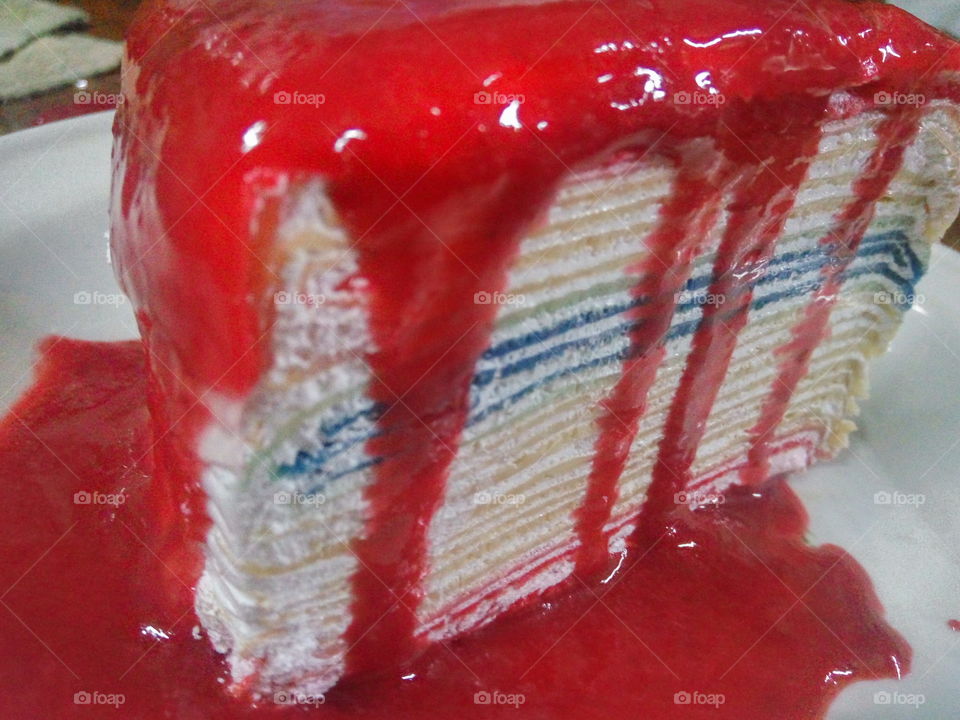 crepe cake with rainbow layers.