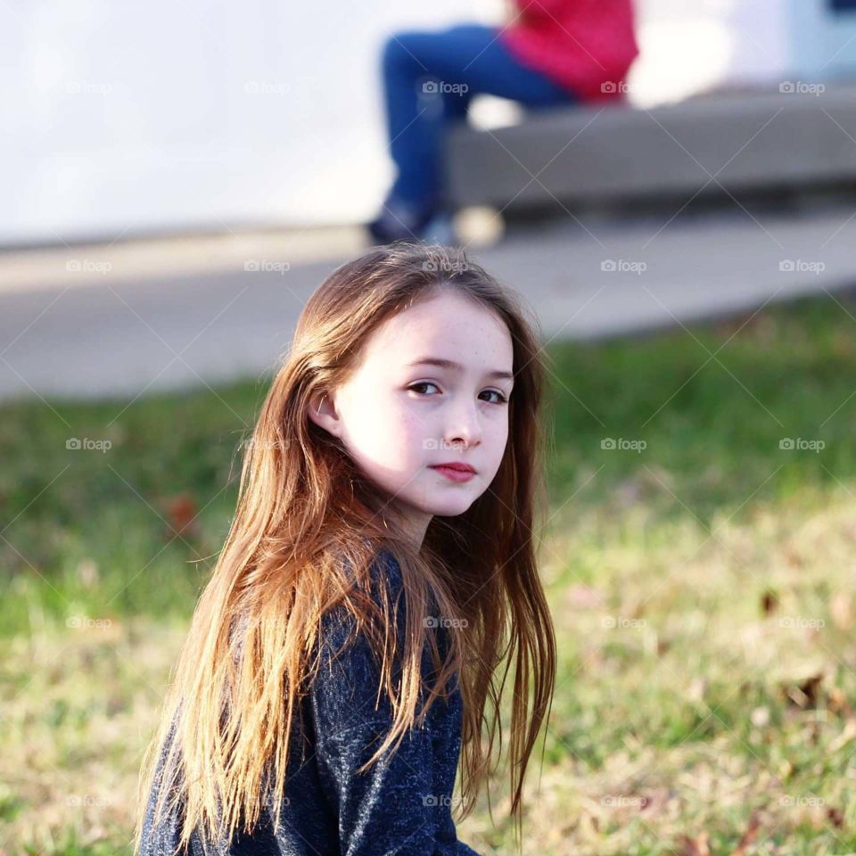 girl looking over her shoulder