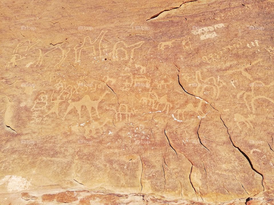 Rock inscriptions on the rock faces of the Wadi Rum desert in Jordan