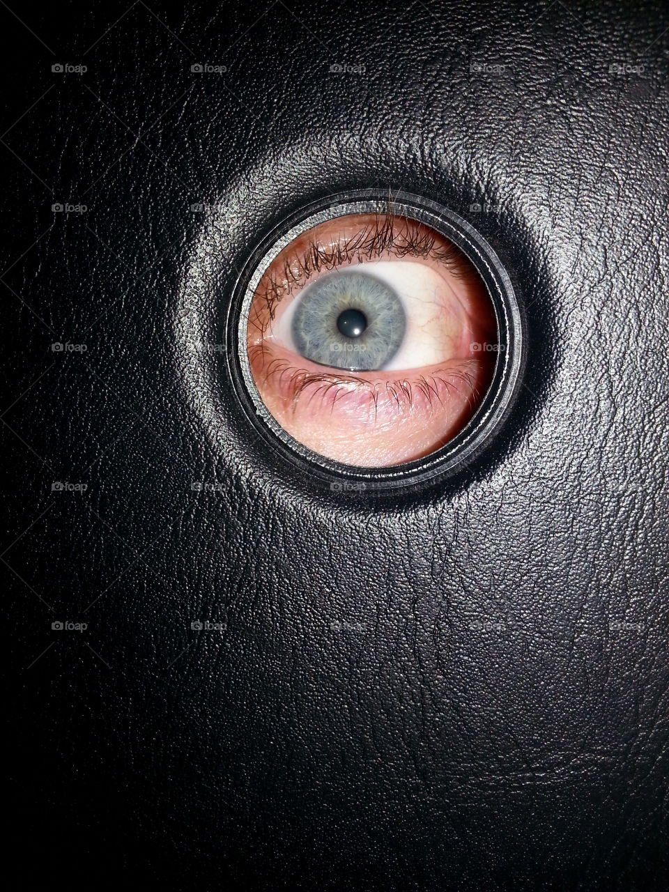 peephole. blue eye