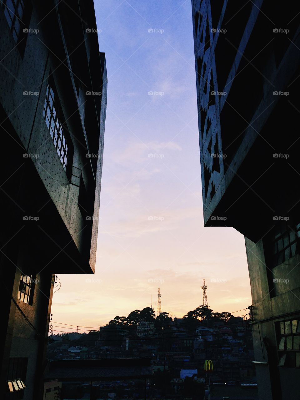 Sunset view between two buildings.