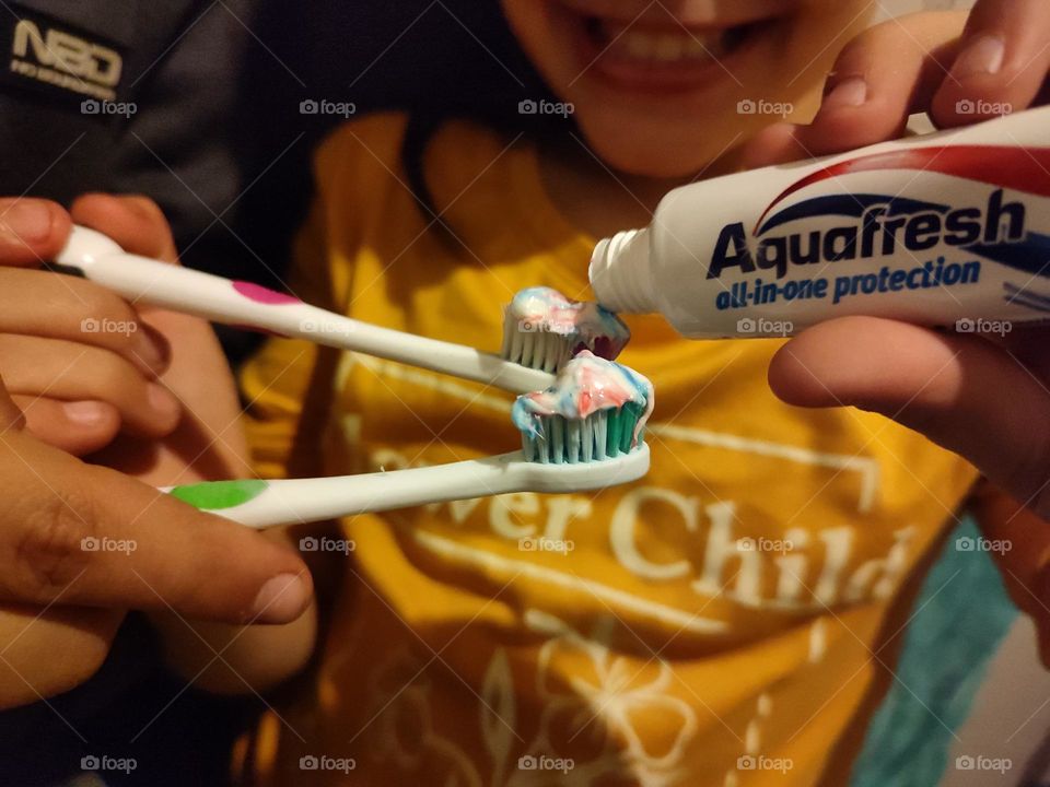 Children using toothpast