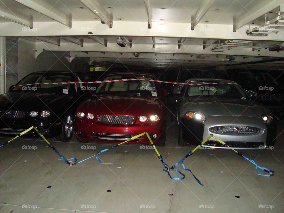 # Cars parked on ship's deck# destination # discharge next port# lashed on ship#