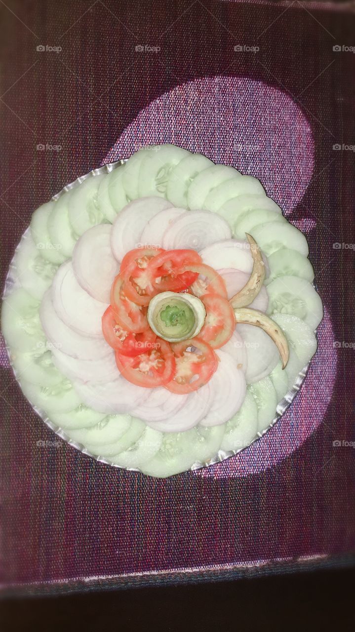 A salad is a serving of the meal that includes leafy vegetables.Uncooked veggies that are sliced into small pieces like onion,tomatoes,cucumber,etc are then mixed with the green leafy vegetables.There are different types or styles of salads.