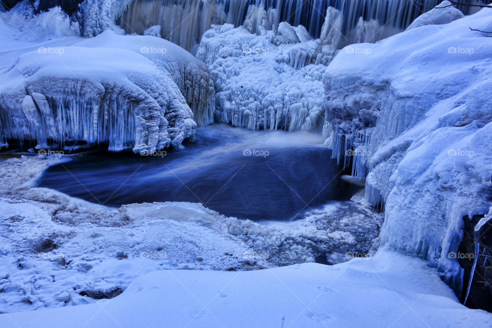 Frozen waterfall. Frozen waterfall (Vanhankaupungin putous) on river Vantaanjoki in Helsinki, Finland.