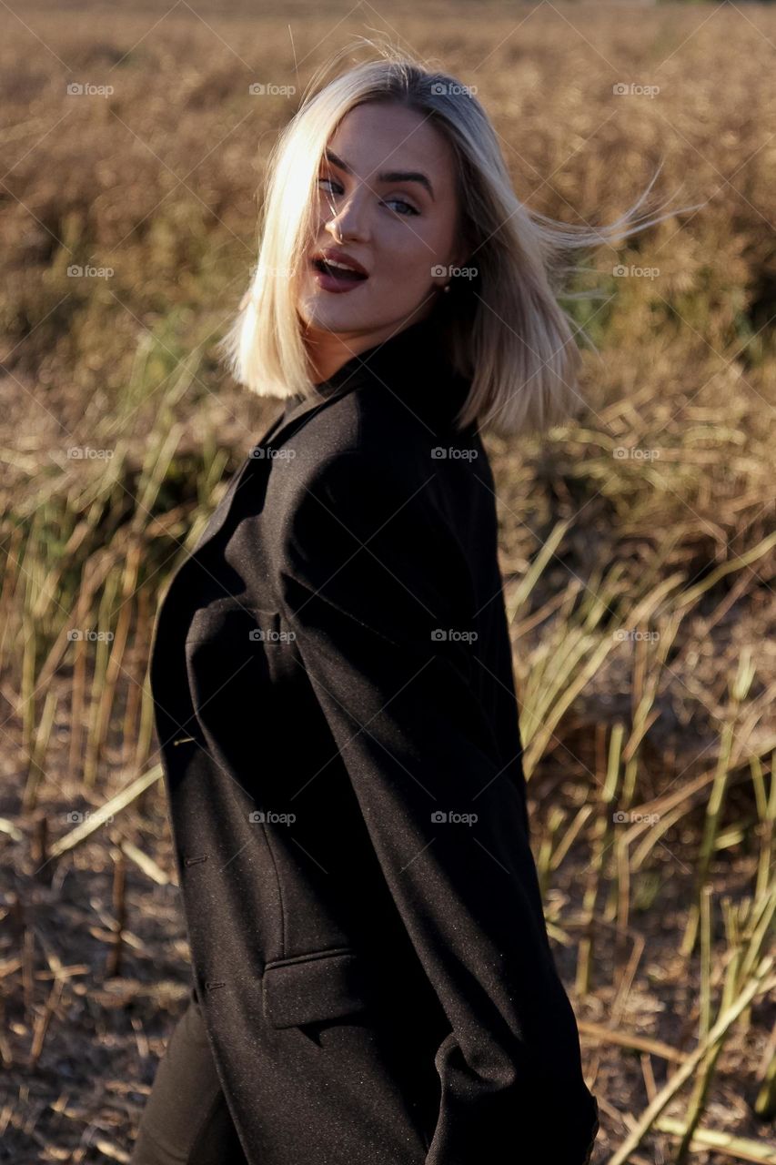 Happy girl walking and looking back