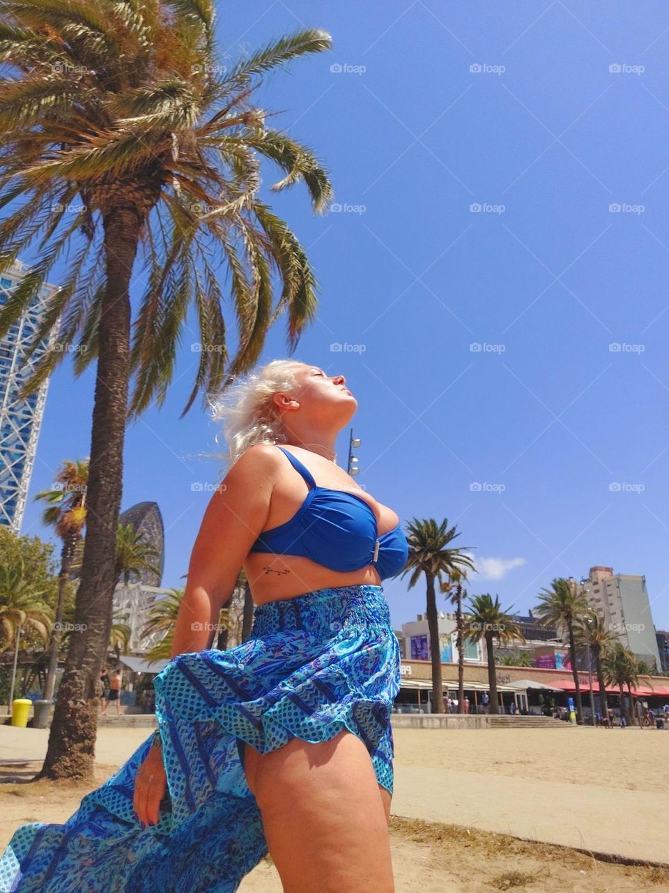 Woman in blue enjoying the sun