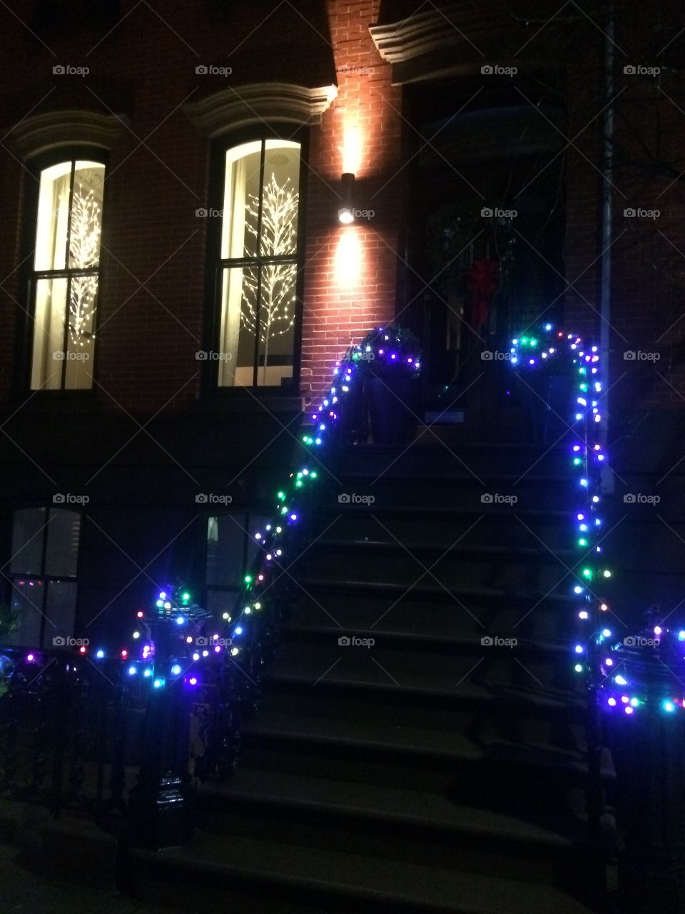 Christmas lights on brownstone