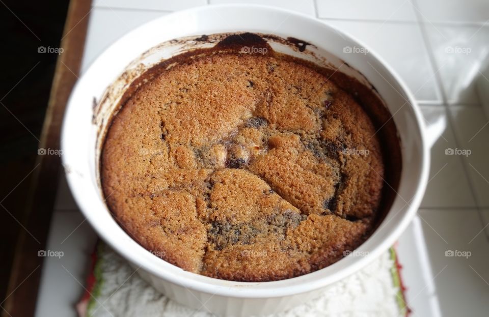 Close up of a old fashioned blueberry pear cobbler ready to eat sitting on the kitchen counter homemade dessert