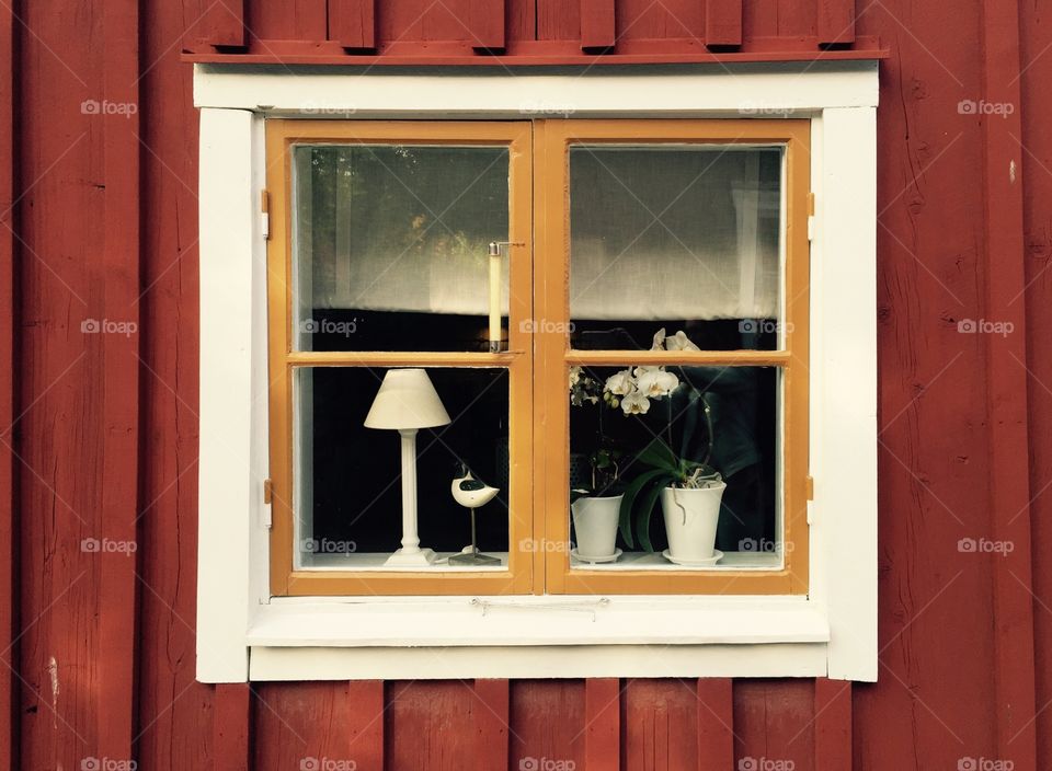 A window. A window in old Swedish wooden house