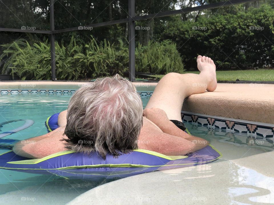 Napping on a Pool float on a quiet summer afternoon