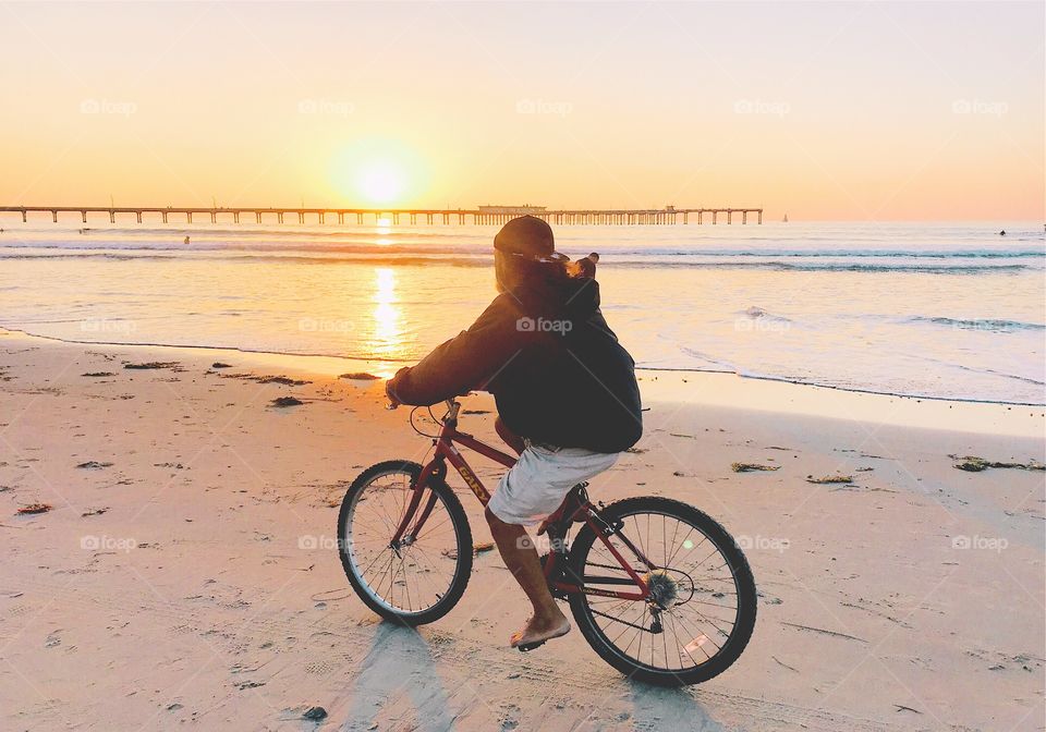 Riding a bike at sunset