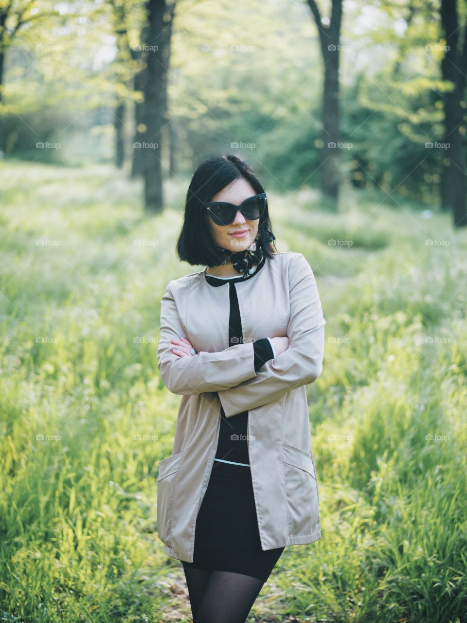 Portrait of beautiful woman wearing in retro style standing in the park 