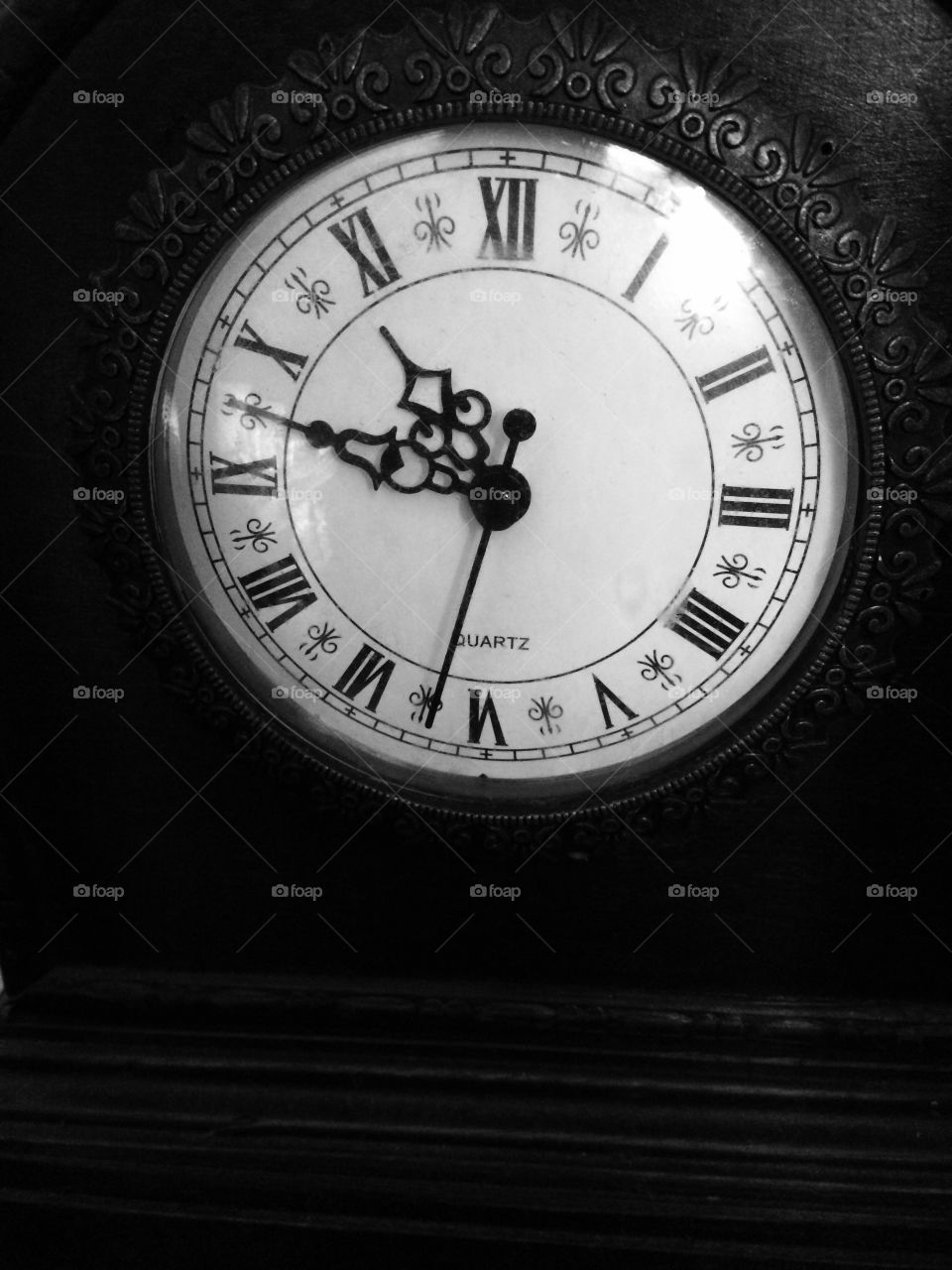 Time. Old clock face in black and white
