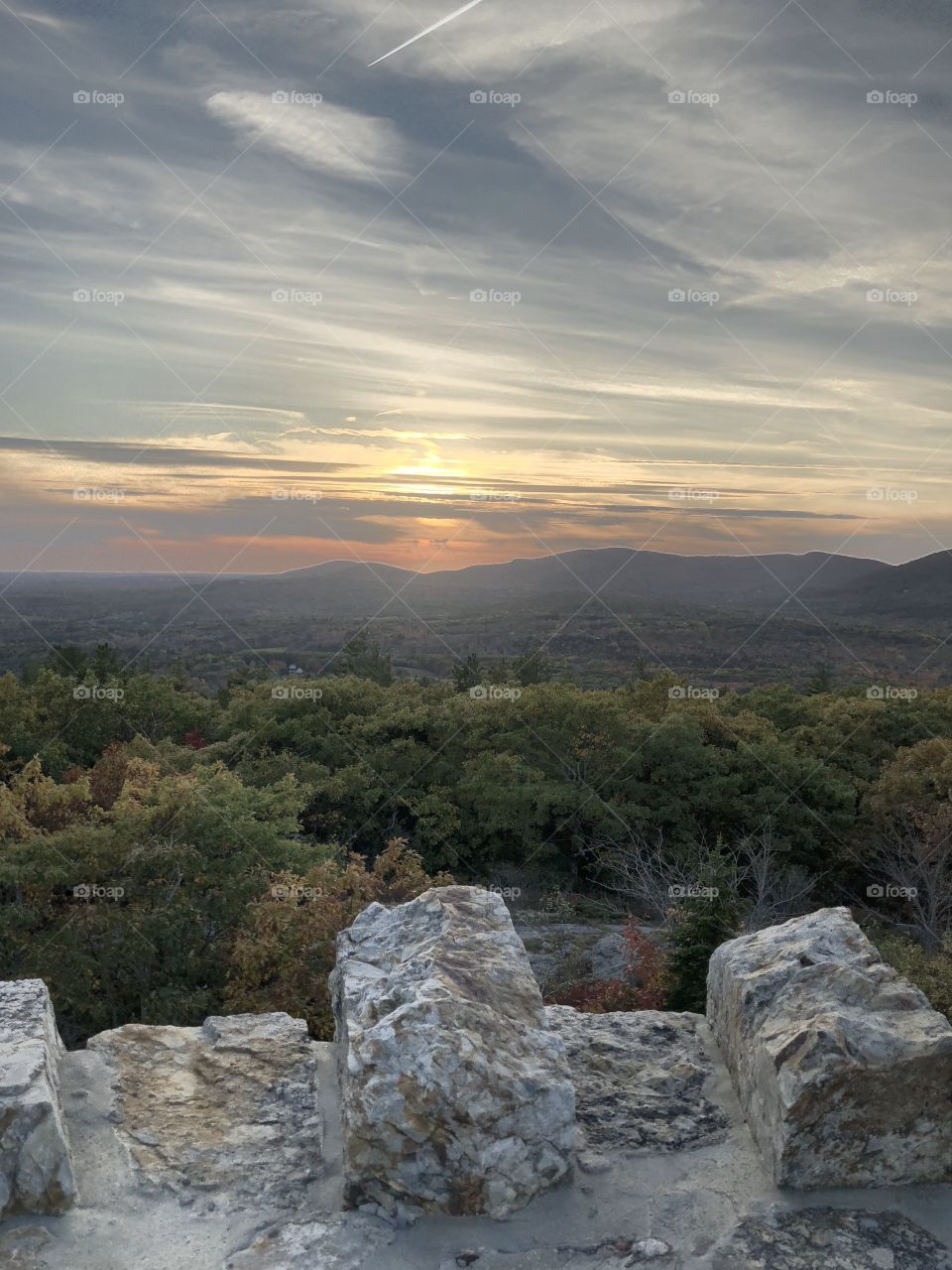 View of skyline over the mountains from a stone lookout tower on top of Mount Battie in Camden, Maine USA 