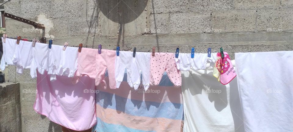 The sight of baby clothes on the clothesline impresses me