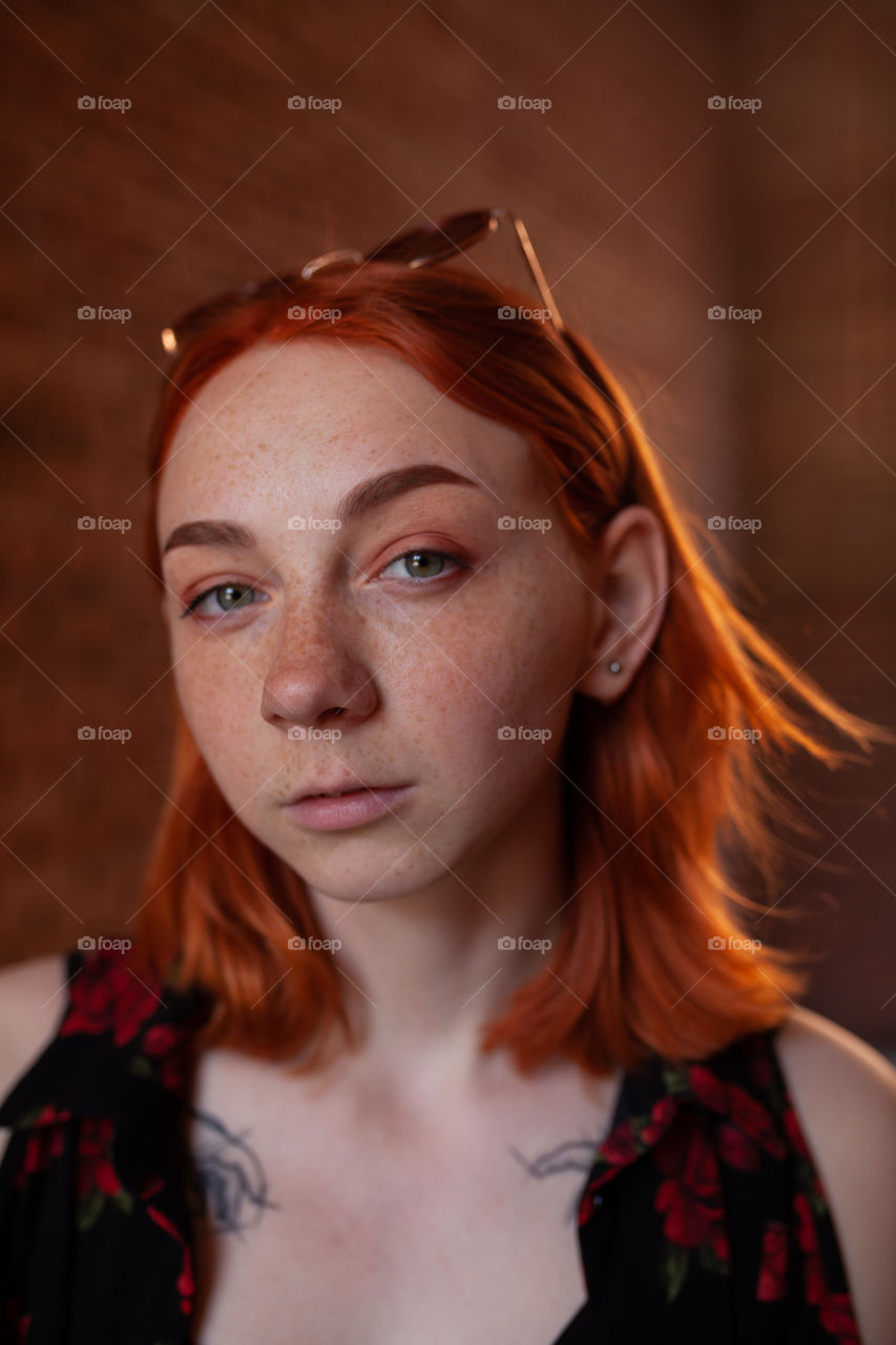 portrait photo of a young woman with bright makeup