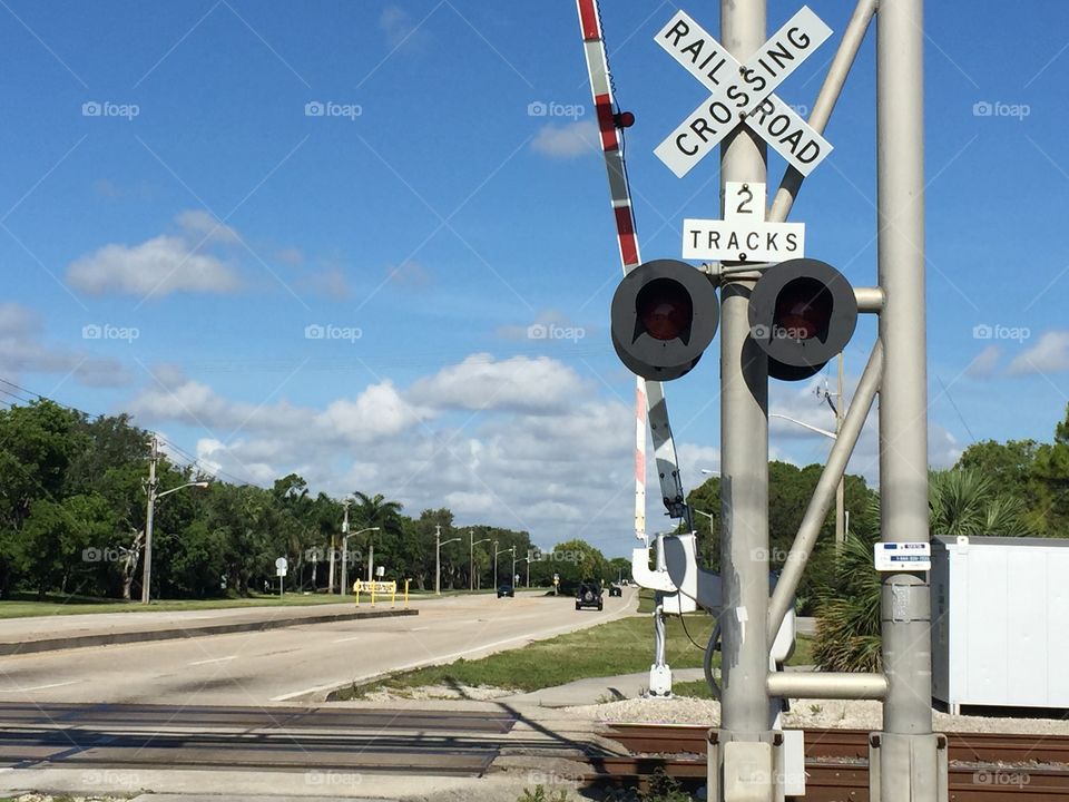 Railroad crossing  . Blue sky's at the cross roads of life