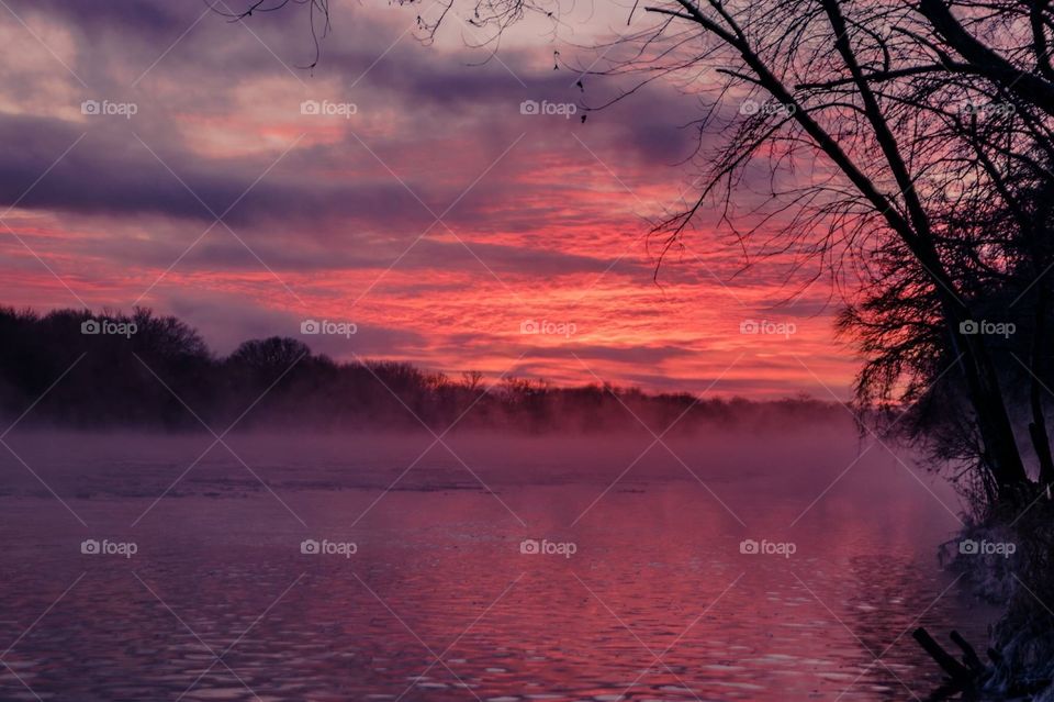 Fog over the lake at sunrise