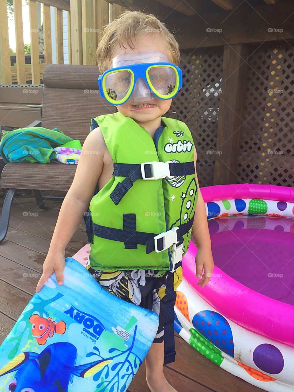 My two-year-old son all suited up and ready for the pool. 