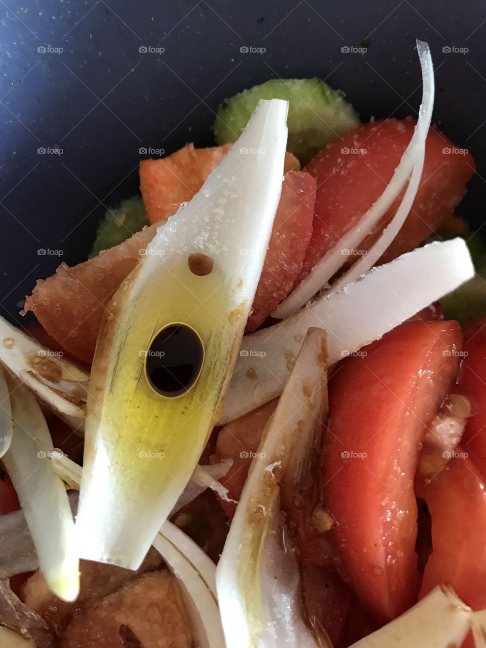 Salad with olive oil and vinegar - yummy.  The vinegar drop has formed an interesting shape
