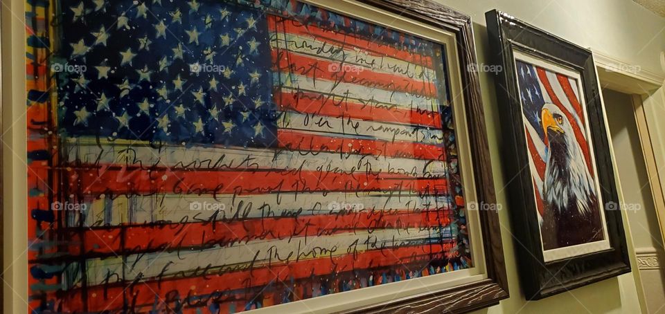 Two artists' works that depict symbols of American independence, freedom, unity, strength & resilience. Tim Yanke's American Flag with the words of The Star-Spangle Banner & Stephen Fishwick's Eagle with the American Flag