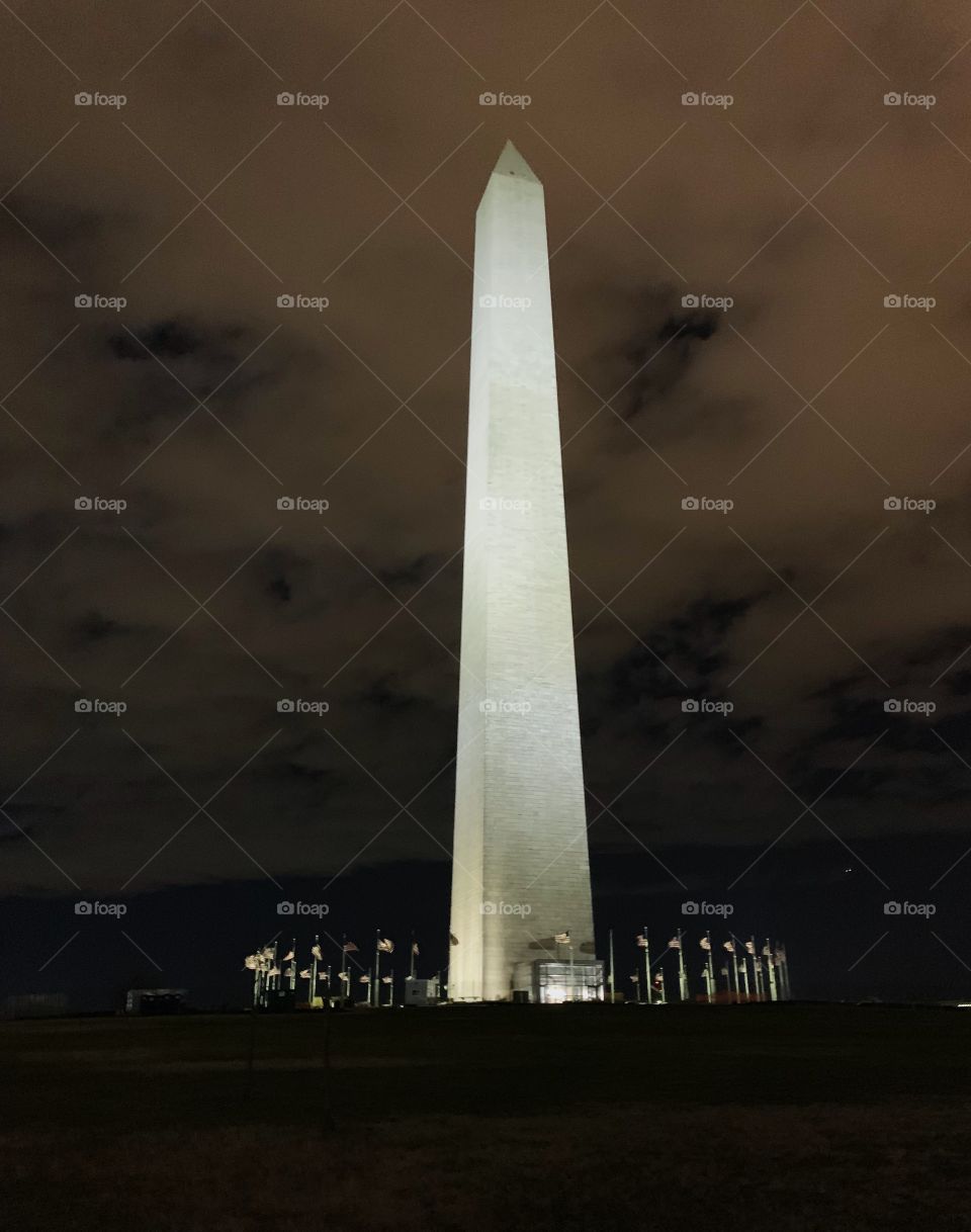 The Washington Monument on the National Mall on a cloudy spring night in Washington D.C