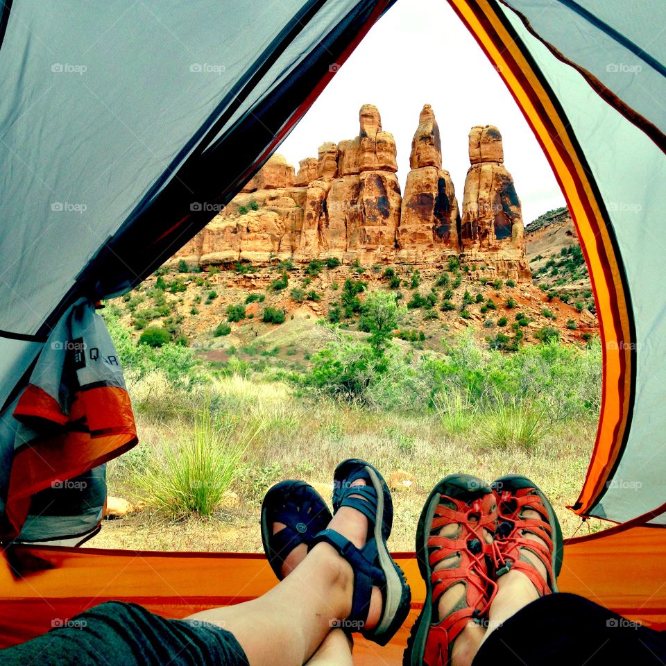 Two friend lying in tent