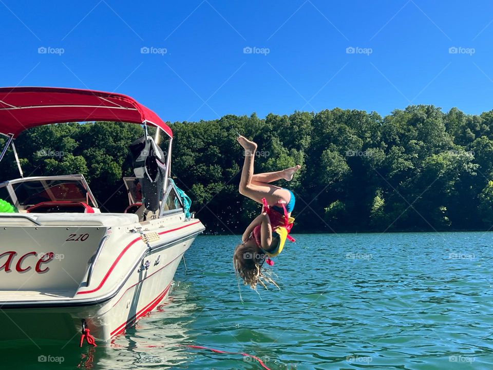 Doing awesome trick jumps off the boat on Lake Cumberland in Kentucky 