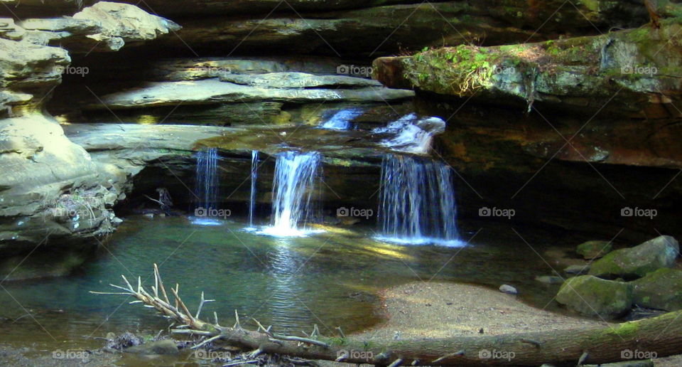 This is a waterfall taken on a warm sunny day at Hocking Hills State Park. 