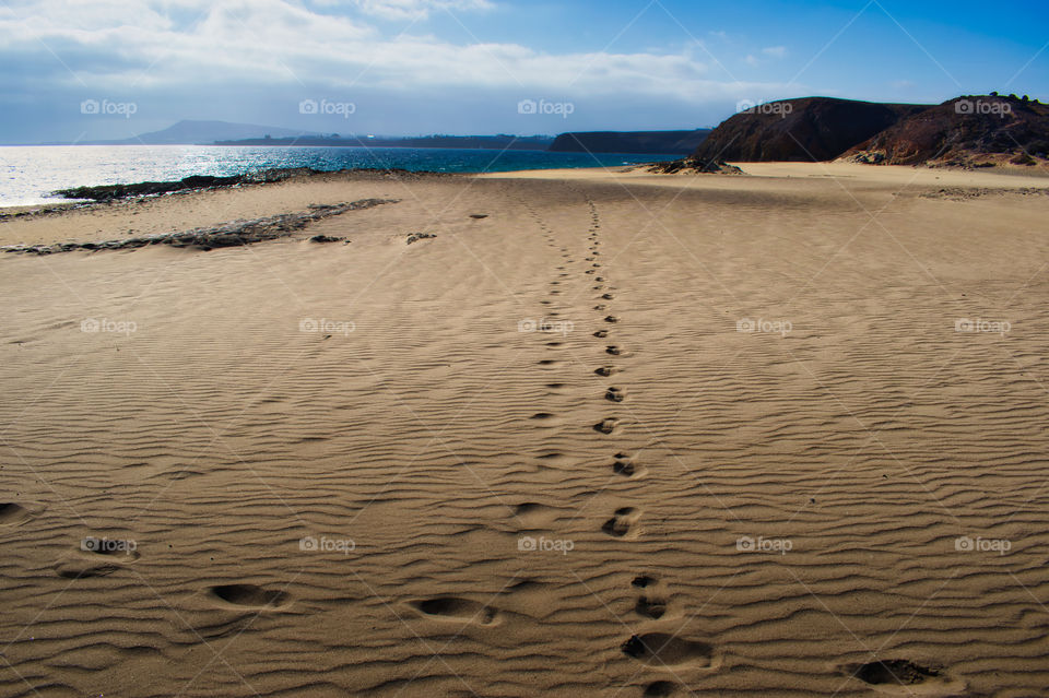 Footsteps at Papagayo beach, Lanzerote, Canary