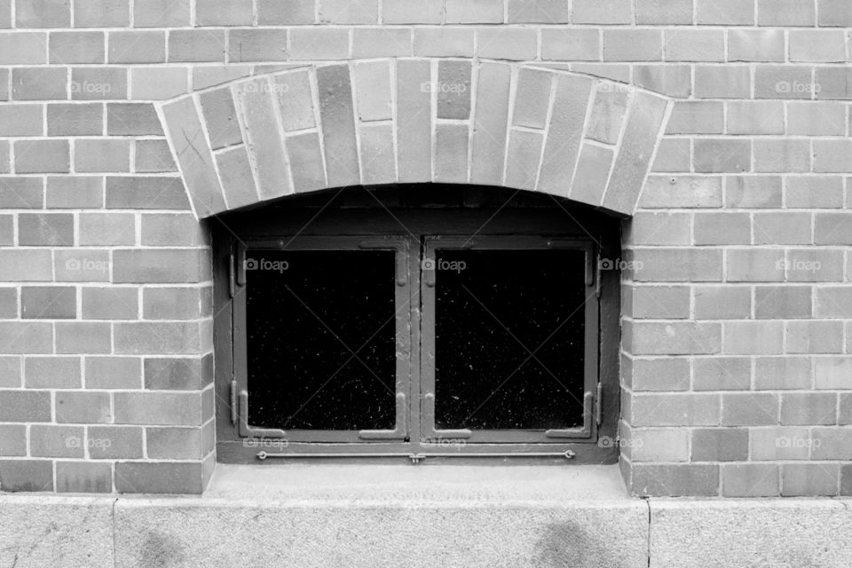 brick work and window in black and white