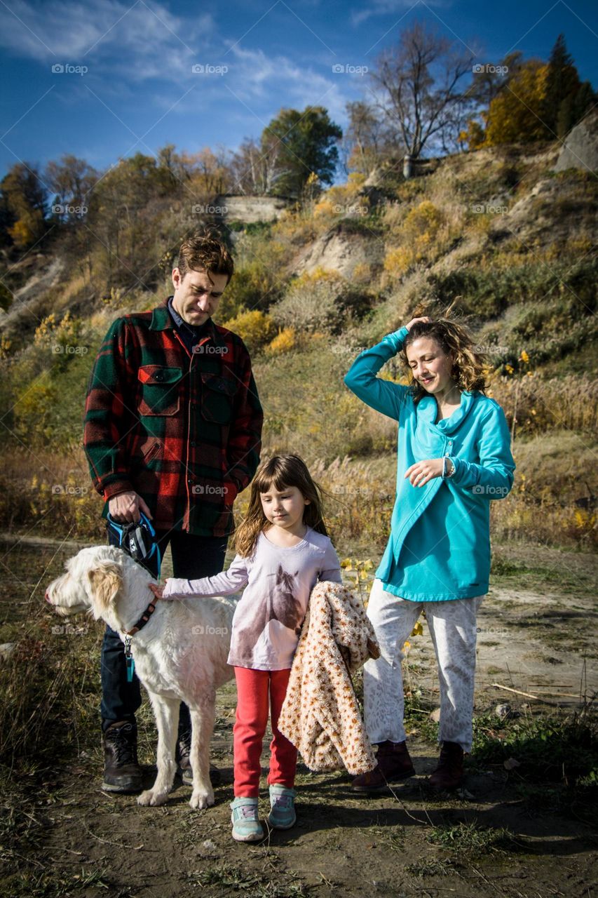 Stylish family outdoors enjoying beautiful autumn