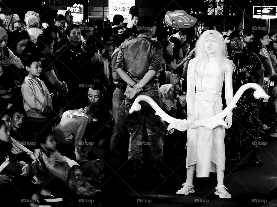 Participants in the cultural carnival parade look scary