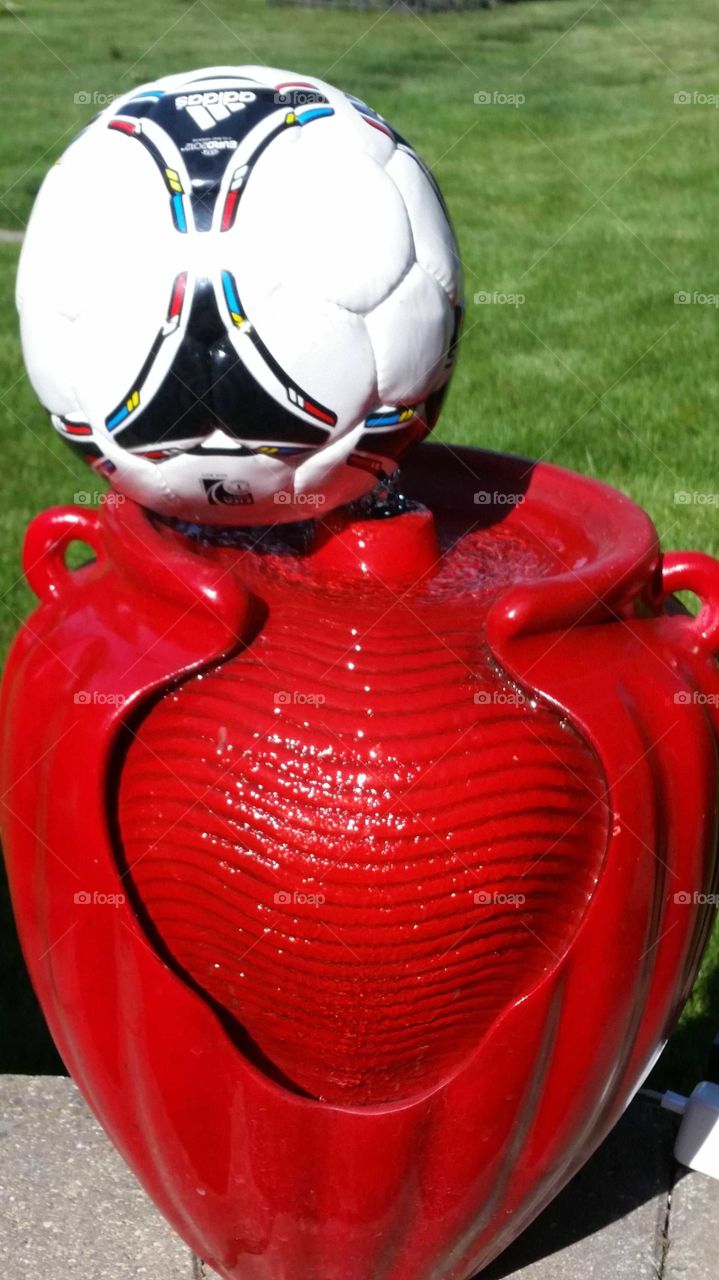 red fountain and soccer