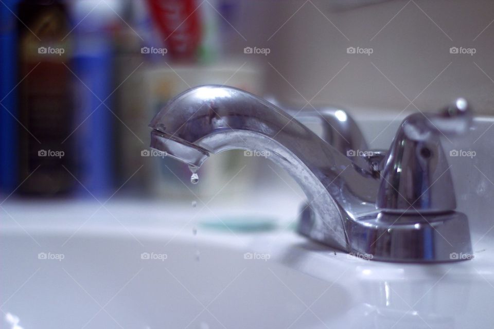 WATER DRIPPING FROM FAUCET