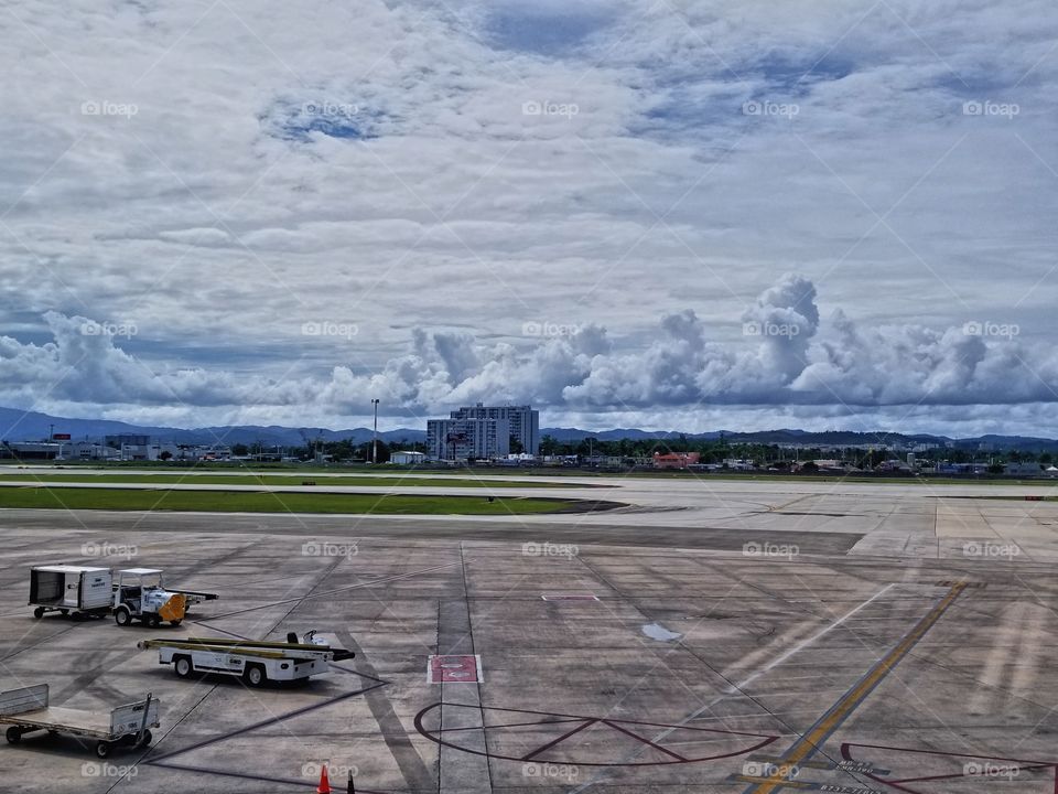 Check Out this amazing cloud formation that covers the whole horizon at Luiz Munoz Marin international airport runway