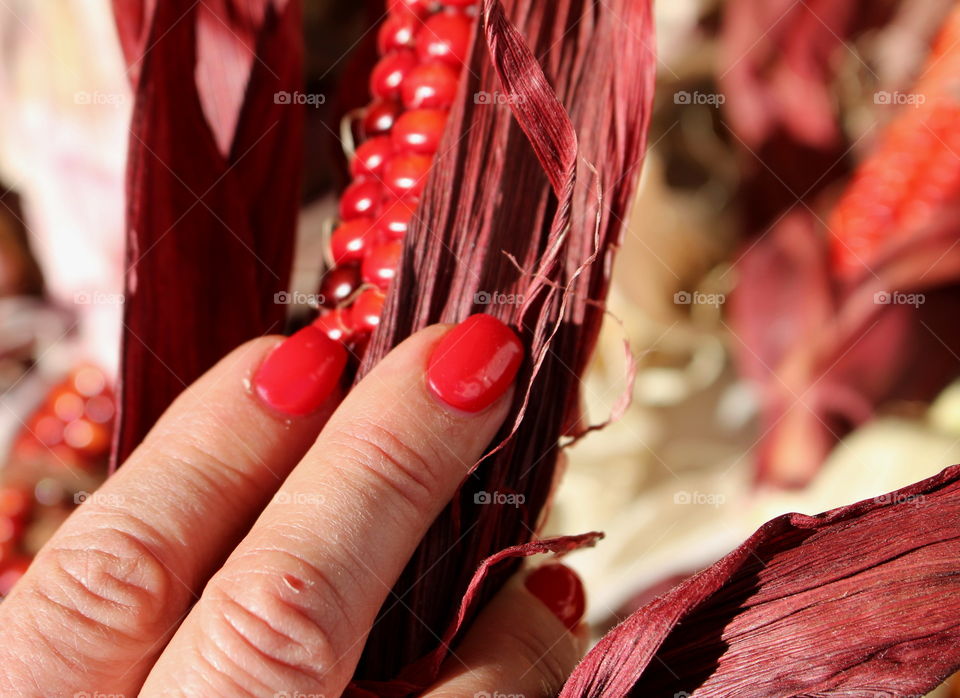 Red nails and red corn.