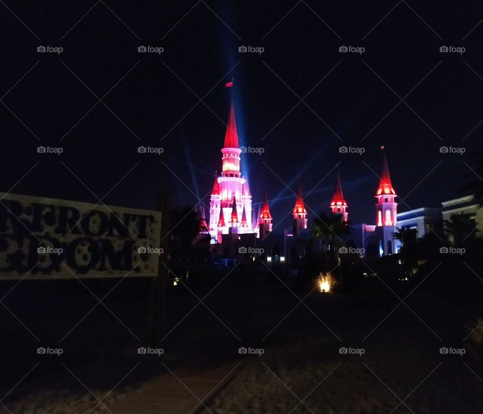 With wonderful lights artificially iluminated building with incredible fairytale architecture. Night photo