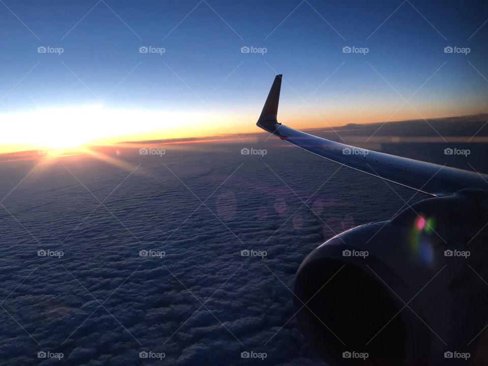 A sunset snapped inside an aeroplane .. 