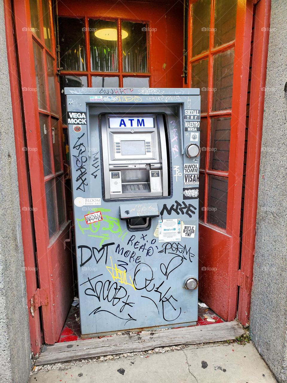 A ATM cash dispenser in downtown New Orleans shows signs it's led a difficult life
