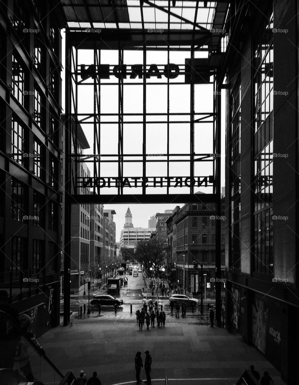 Silhouettes and shadows - the Boston garden and it’s sports fan silhouetted against the gray backdrop. 