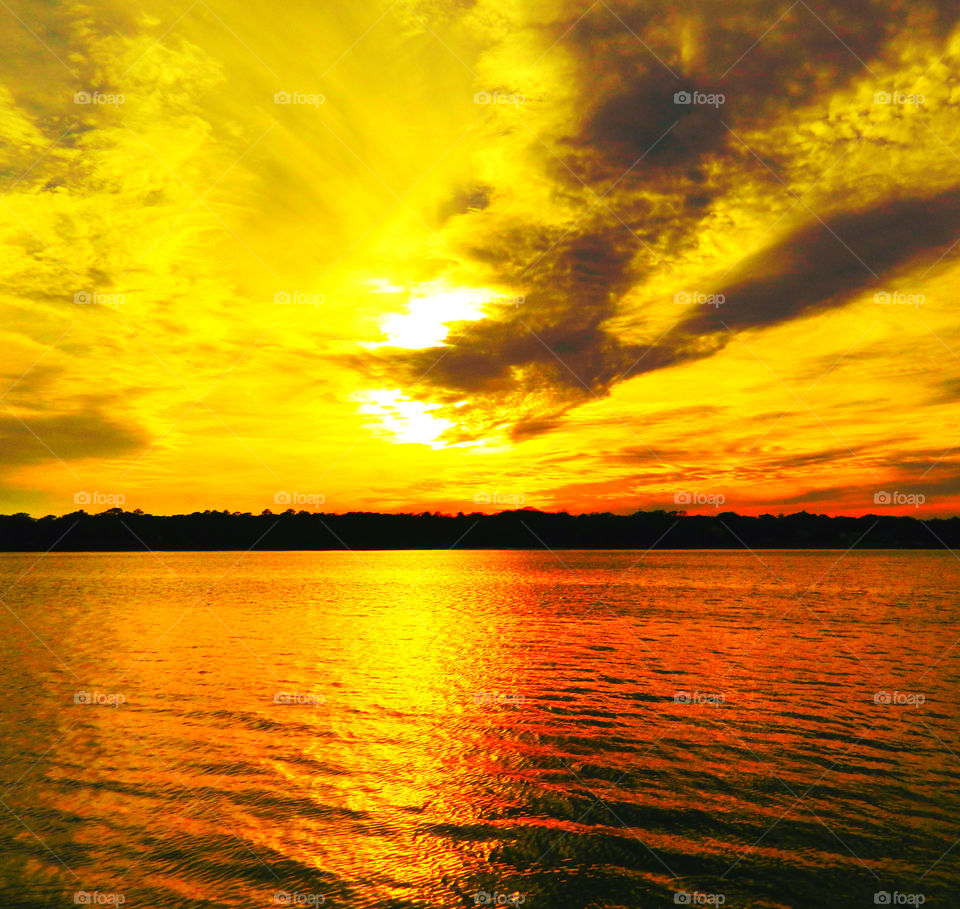 Reflection of yellow sky at sunset