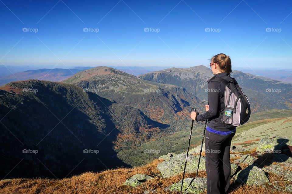 Woman hiking looking  out over  Valley mountain 